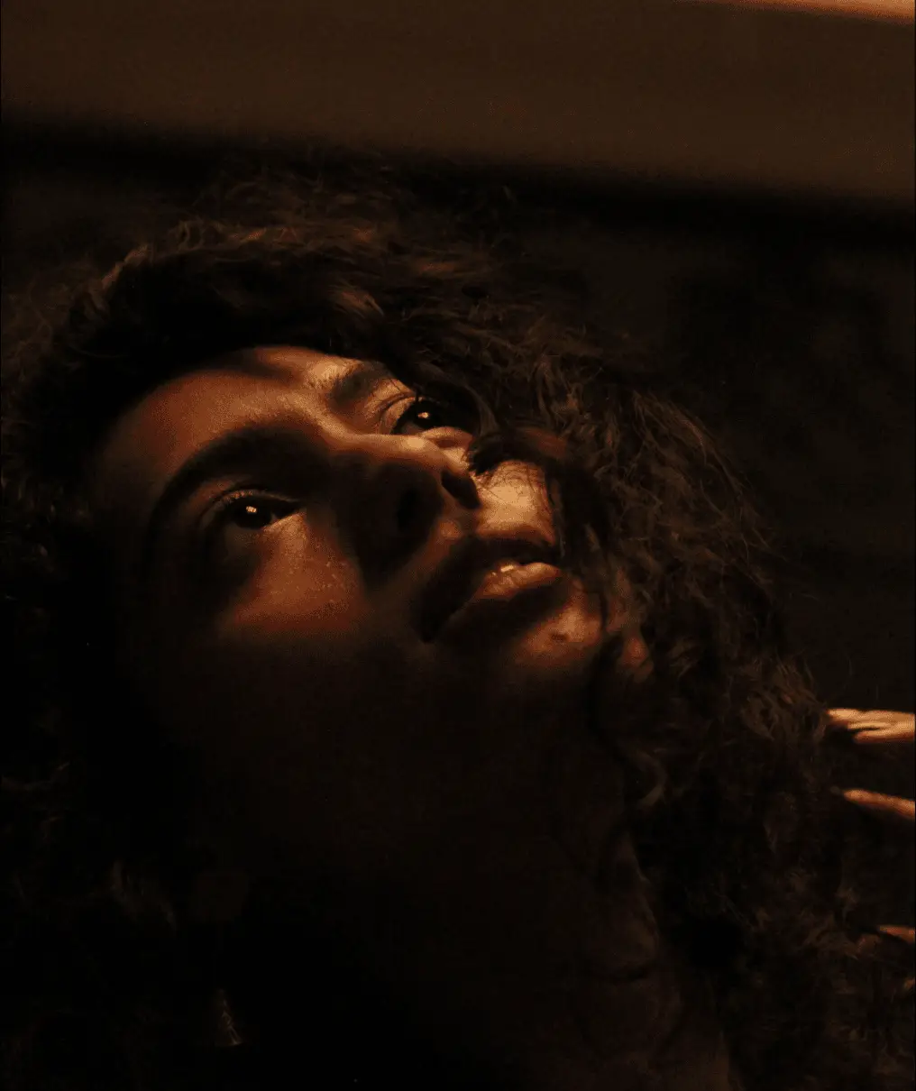 Low-light portrait in warm tones